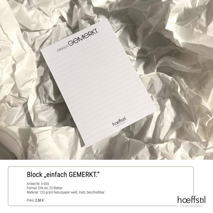 Ein Notizblock auf zerknülltem Papier, beschriftet mit "Block einfach GEMERKT".