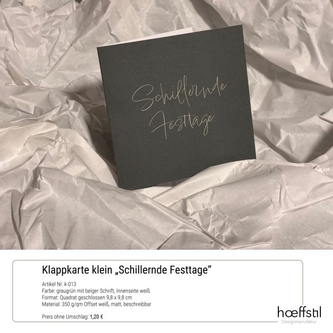 Klappkarte graugrün mit beigefarbener Aufschrift "Schillernde Festtage"